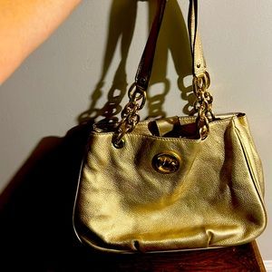 Gold Michael Kors handbag with gold chain details. Mint condition.
